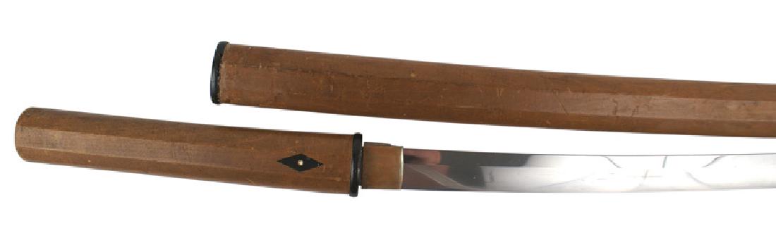 Japanese Koto Period katana Samurai sword: D-172 Japanese Koto Period katana. 26 1/2" clean slightly curved blade with a billowing temperline. Two linear blemishes. Copper habaki. Tang has two holes and one old plug. The partial knaji on the c