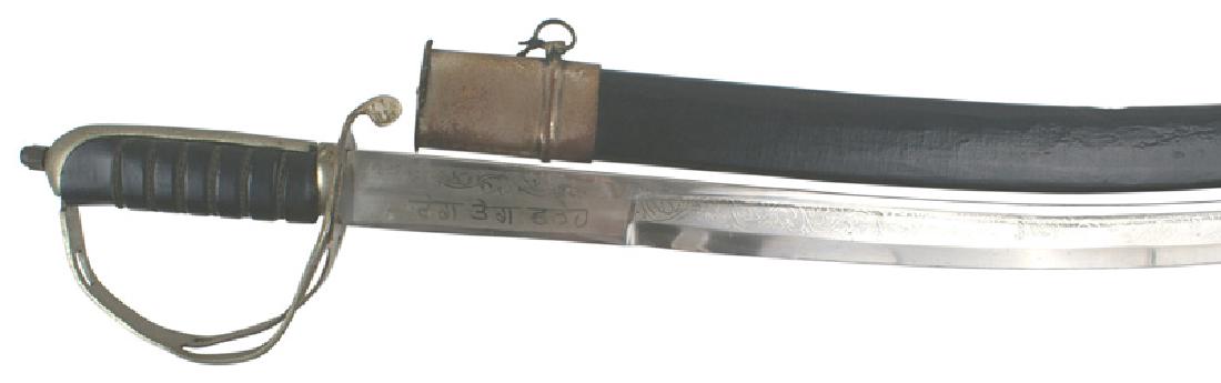 Decorator sword MADE IN INDIA: D-200 Curved blade decorator sword. Age toned nickled backstrap and knuckle bow with three branches. Black leather wrapped grip. Clean 30 1/2" blade decorated with floral work and "MADE IN INDIA". Lig