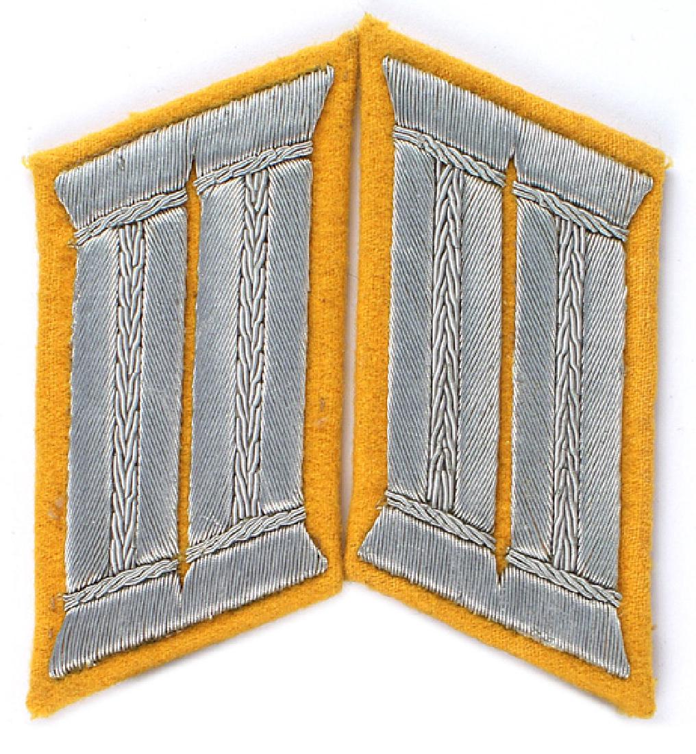 German WWII Army Cavalry Officer collar tabs: H-054 German WWII Army Cavalry Officer parade dress collar tabs. Embroidered silver wire bars on a yellow-gold background. Pair. II