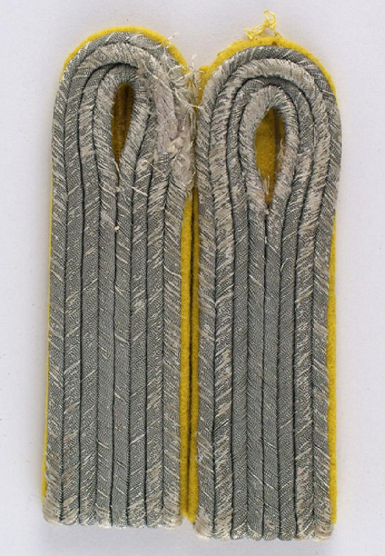 German WWII Army Signal Lt. shoulder boards: H-060 German WWII Army Signal Lt. slip-on shoulder boards. Gray cords on lemon yellow backing. Show wear, were obviously removed from a tunic. II-