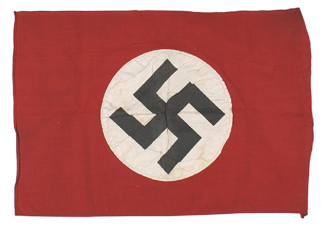 German WWII NSDAP parade flag: H-079 German WWII N.S.D.A.P. small 20" x 13" parade flag. Black printed swastika on a white roundel sewn to a red field. II