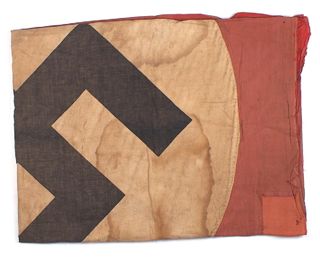 German WWII NSDAP building banner flag: H-085 German WWII N.S.D.A.P. building banner. 86" x 60". Large black printed swastika on a 45" diameter white circle sewn to the red field. A well worn flag which shows period repairs including a repl
