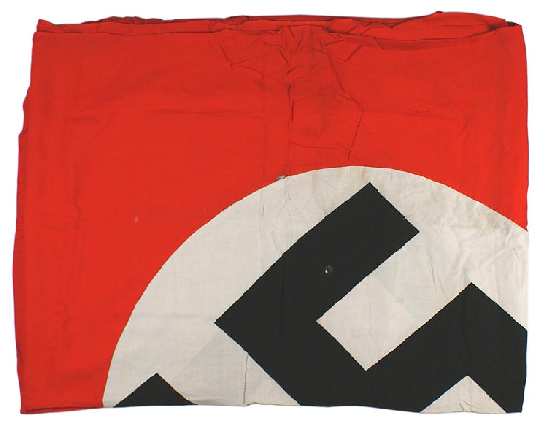 Large German WWII NSDAP banner flag: H-087 Large German WWII N.S.D.A.P. banner. Black printed swastika on a white disc, sewn to a red field. Two small holes and lightly soiled. 9' x 4'6". II