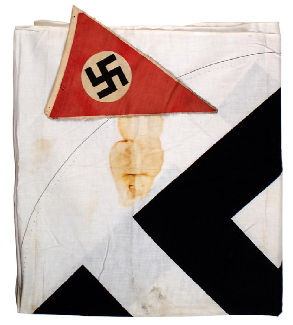 Lot of 2 German WWII flags: H-088 Lot of 2 German WWII flags: (1) N.S.D.A.P. printed triangular pennant. Black swastika on a white circle - on a red field. 10 1/2" x 7 1/2". Probably cut from a "string of flags". (2) Unfinished 