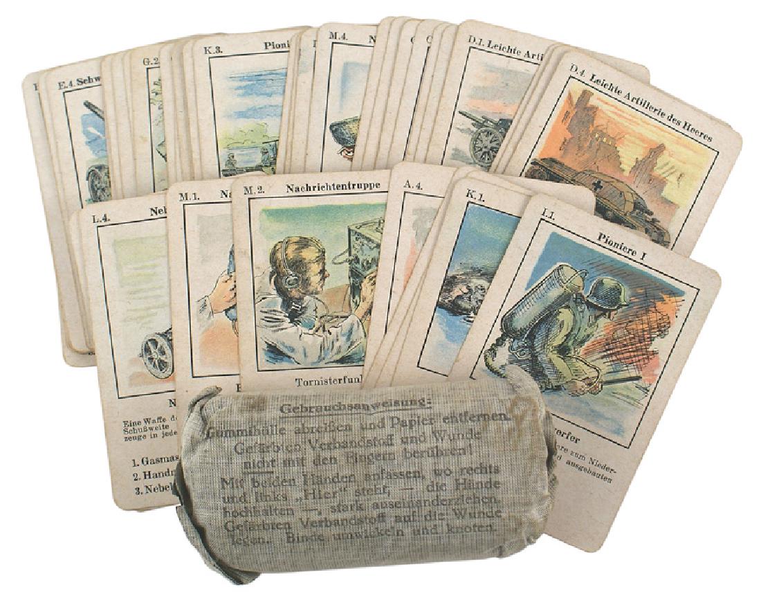Lot 2 German WWII playing cards bandages: H-121 Lot of 2 German WWII items: (1) Set of instruction playing cards. Each shows a different weapon or piece of equipment. (2) Unopened military bandage kit. Dated "1942".II
