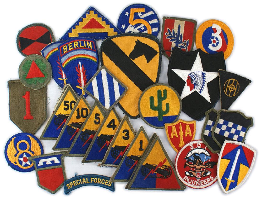 Lot 36 U.S. embroidered shoulder patches: H-162 Lot of 36 U.S. embroidered shoulder patches. With the exception of six pieces all of the remaining are from the WWII era. Includes eleven Armored (seven different); three Army Air Force; fifteen