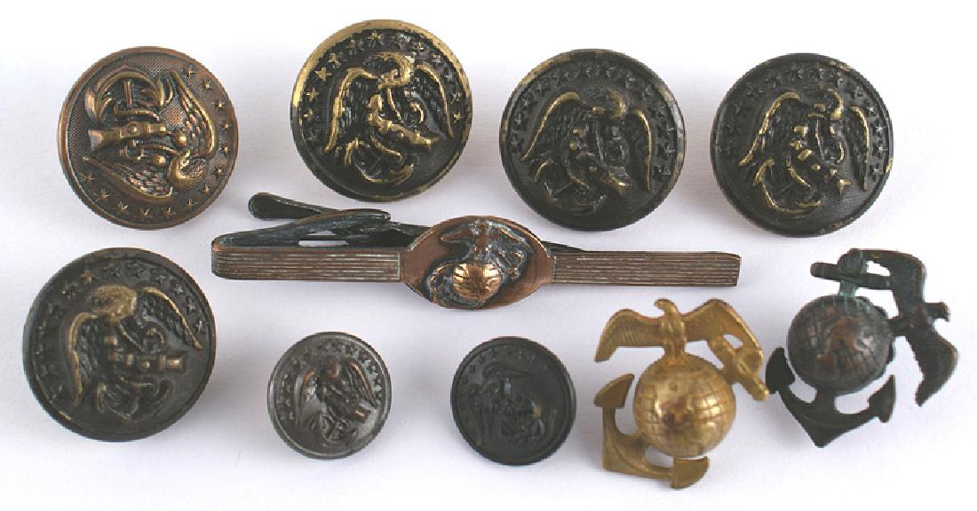 Lot 2 U.S. Marine Corps WWII tunic lapel EGAs: H-170 Lot of 2 U.S. Marine Corps WWII tunic lapel. EGAs. One is brass and the other is darkened. Also a WWII era tie bar and seven uniform buttons. II