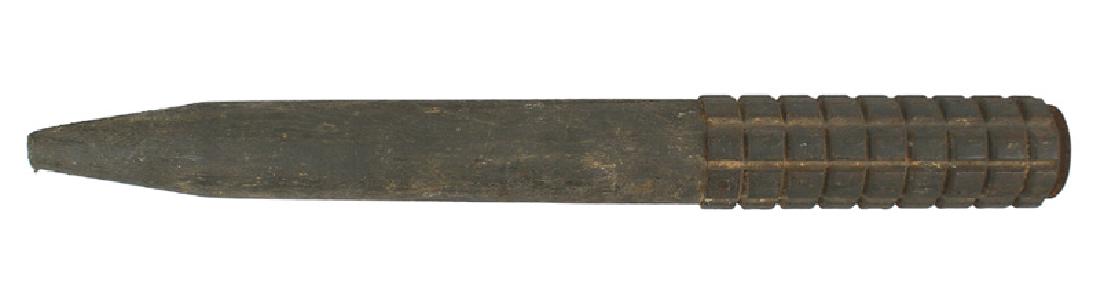 German WWI stationary stake grenade: H-255 German WWI stationary stake grenade. 5 1/4" iron cylinder with external "pineapple" serrarations. Missing the cap. Mounted on a 10" stake, with atapering point. Original feld-grau finish. An eff