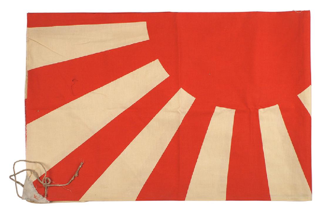 Japanese WWII Marine rising sun flag: H-259 Japanese WWII Marine "rising sun" flag. 34 1/2" x 52". Lower left corner is ink stamped with a red anchor. Two corners have hand stitched cloth tabs with cord ties. Flag was probably washed some