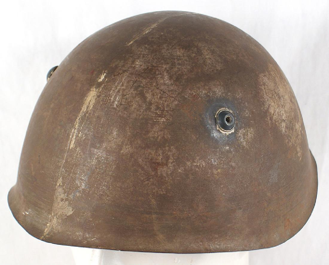 Lot of 3 Italian WWII helmets: E-068 Lot of 3 Italian WWII helmets: (1) 95% of the original green finish remains. Some chipping along the extreme edge of the helmet. Brown leather drawstring liner. Original leather chinstrap. (2) S