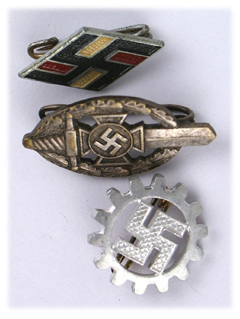 Lot 3 German WWII lapel pins DAF Student NSKOV: B-045 Lot of 3 Third-Reich lapel pins: (1) DAF (German Labor Front). Swastika within an open cog wheel. Marked "M1/1" and "RZM". (2) Student Association "diamond". Swastika on red/white. Marked "1/19"