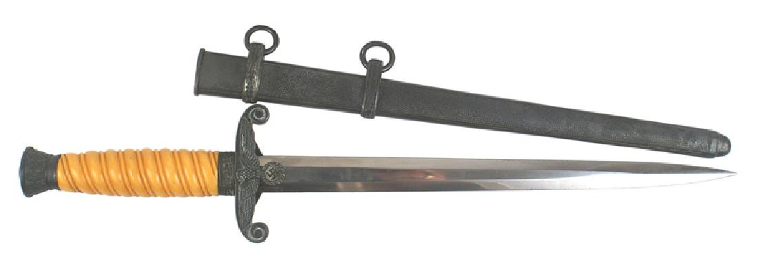 German WWII Army officer dagger: D-004 Army officer dagger. Deep purple patina on the age toned silvered oak leaf decorated pommel and eagle/swastika crossguard. Deep yellow-orange grip. About excellent Eickhorn blade with the squirr