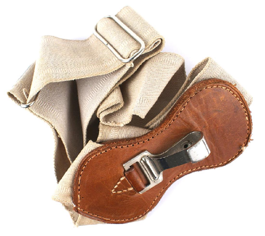 German WWII Army Luftwaffe sword hanger: D-058 German WWII Army/Luftwaffe officer's sword hanger. 1 3/4" wide cloth shoulder belt with a 5" x 2 1/2" leather tab with a snap hook. II