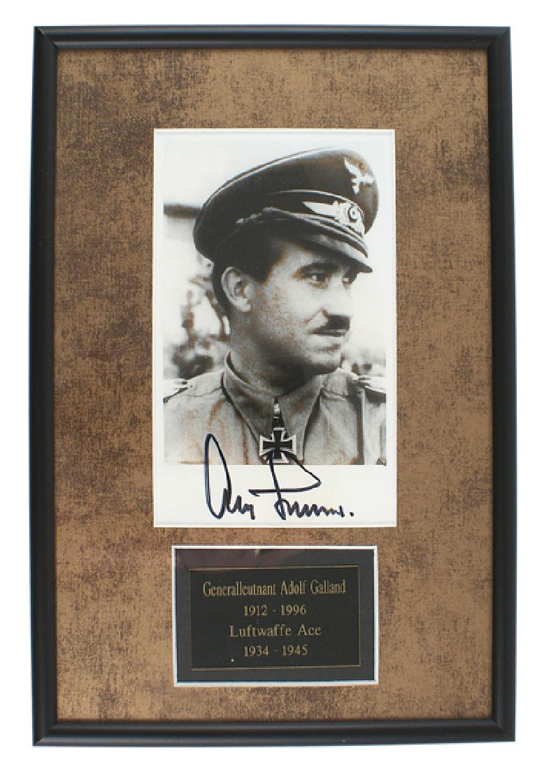 German WWII autograph Luftwaffe Adolf Galland: S-011 Luftwaffe General Major Adolf Galland. Post-war copy of a Hoffman photo card with a felt pen signature. Recipient of the Knights Cross with Oak leaves, swords and Brilliants. Professionally fram