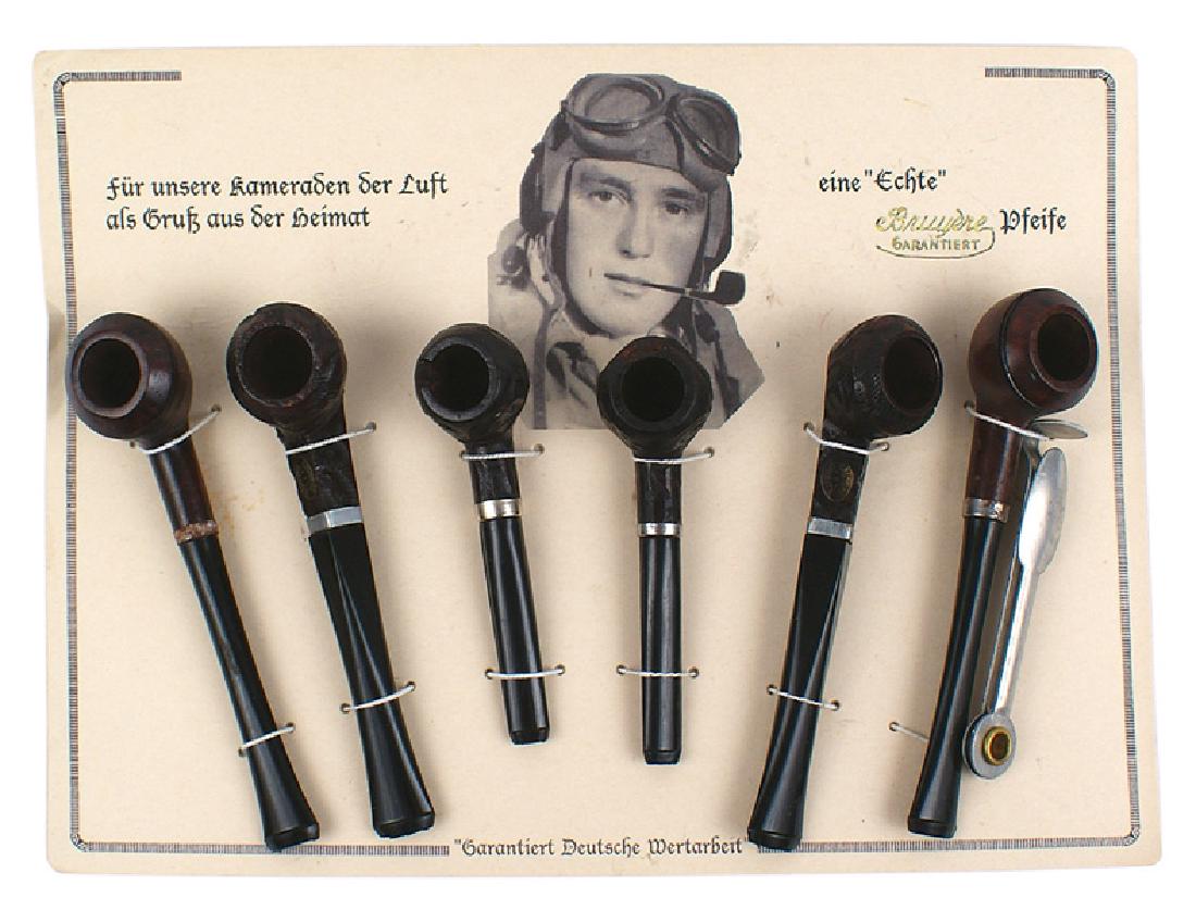 Original German WWII wartime pipe sales display card: H-089 Original wartime pipe sales display card. 7 3/4" x 10 5/8" hard stock, showing a helmeted pilot smoking a pipe. Also with "For our comrades in the air. All the luck from the home front". Also "O