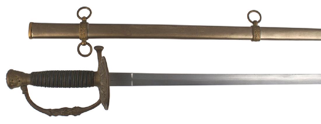 US M1860 Staff / Field Officer sword: K-051 U. S. Model 1860 Staff and Field Officer's Sword. Age toned brass eagle decorated pommel, reverse "D" knuckle-bow and clam shell guard bearing a relief American eagle with crossed flags. Wire wr