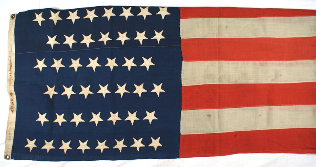 American 44 star flag circa 1891: K-062 American 44-star flag (1891). Separately sewn, zig-zag stitched white silk stars on a machine sewn canton and stripes. Ink signed border "A.D. de Busey - 186 Westwood Road. Three brass grommets.