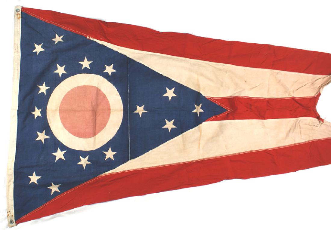 US State of Ohio patriotic pennant flag: K-072 State of Ohio patriotic pennant. Narrowing 36" x 60" swallow - tail bearing the "Buckeye" emblem on a blue field with 17 white stars - all on a red field with two wide white stripes. Tips of the