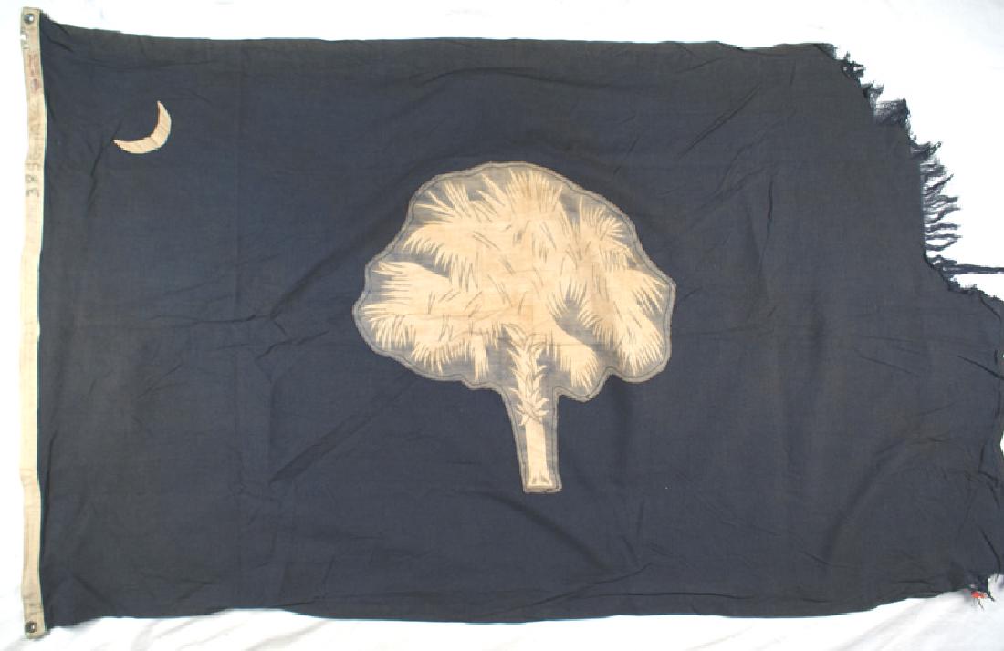 US State of South Carolina flag 1918: K-073 South Carolina state flag. White palm tree and crescent on a blue filed. Border has date "1918", "38 S.C.", maker's label (DEFIANCE) and metal grommets in corners. Upper 1/2 edge of border is fr