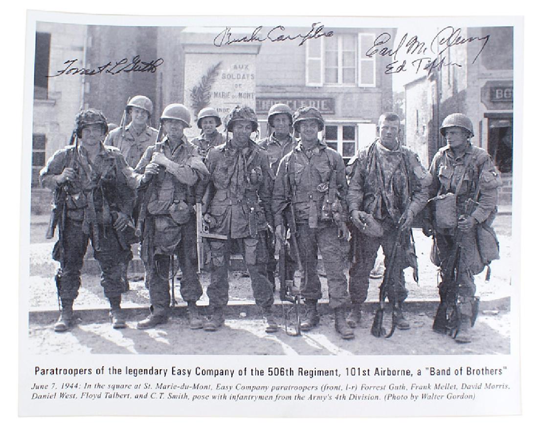 Lot of 5 US post-WWII photos Band of Brothers: L-019 Lot of 5 Post-War 10" X 8" photos of the "Band of Brothers" (Easy Company, 506th Regt., 101st Airborne). Includes: a June 7, 1944 photo of 6 members with several 4th Division soldiers - signed b