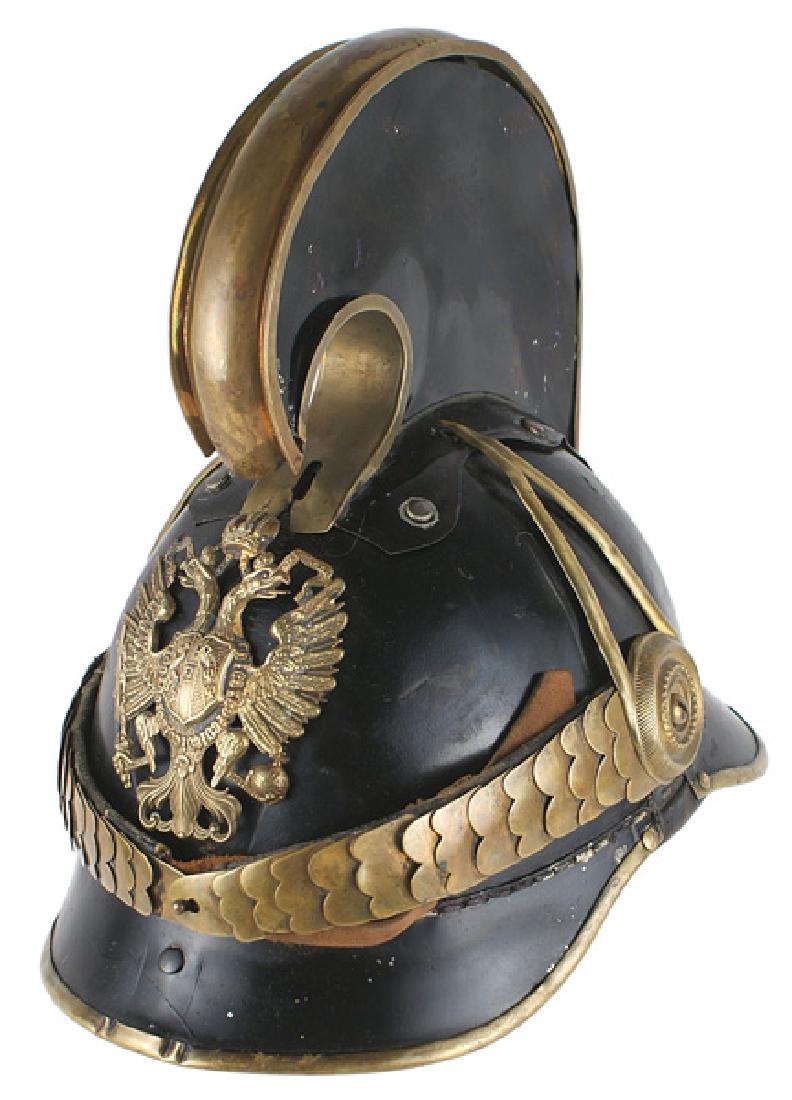 Imperial Austrian Dragoon M1905 NCO helmet: E-003 Austrian Dragoon M1905 Non-commissioned officer's helmet. Black leather body with brass trimmed metal visors. Brass double - headed eagle front plate, chinscales and side bosses with "teardrop"