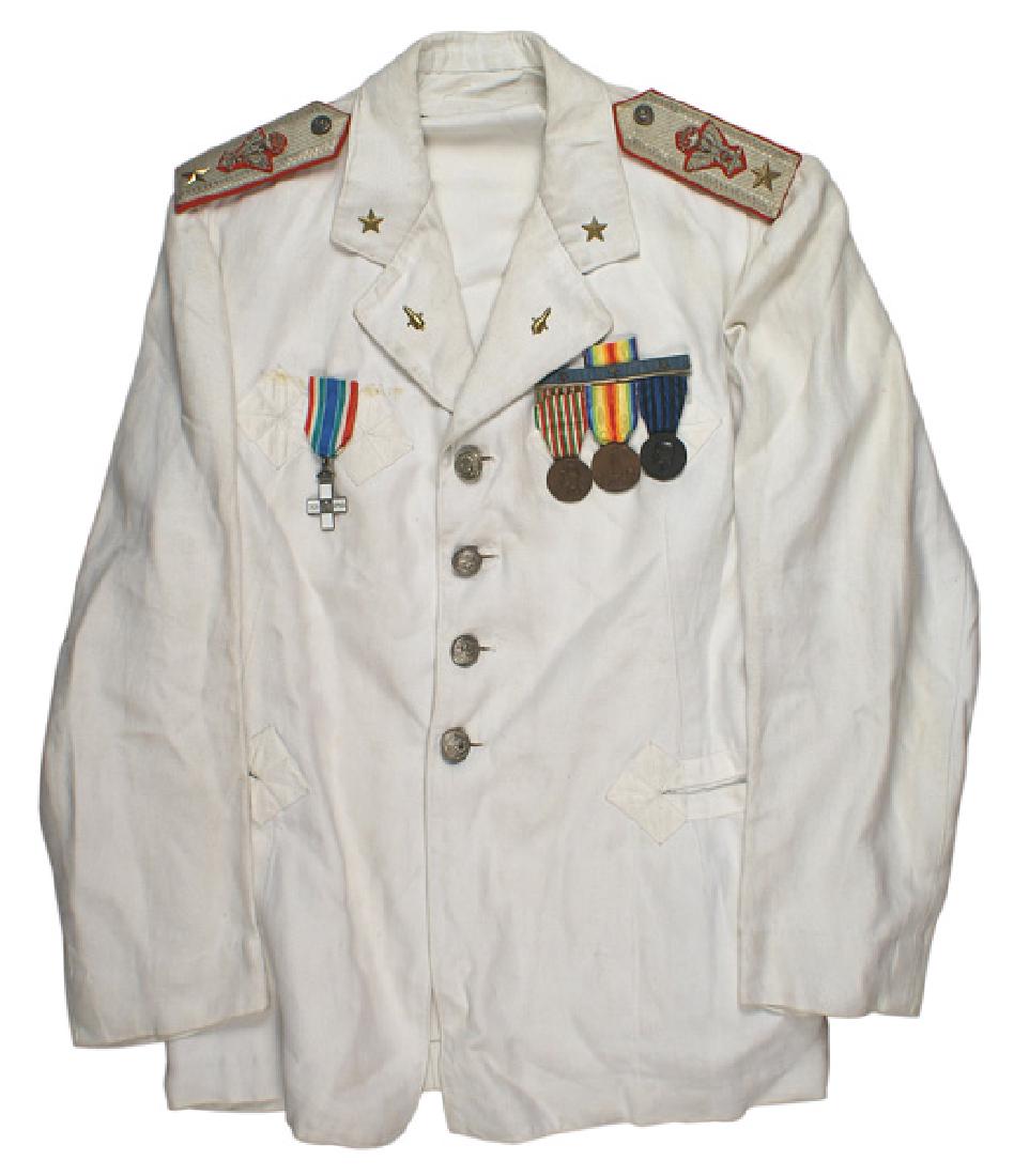 Italian Fascist General of Artillery white tunic: F-052 Italian Fascist General of Artillery white summer tunic. Open collar type with an affixed gold star and cannon type device on lapels. Four silver domed buttons with a classic helmet, flag, sword