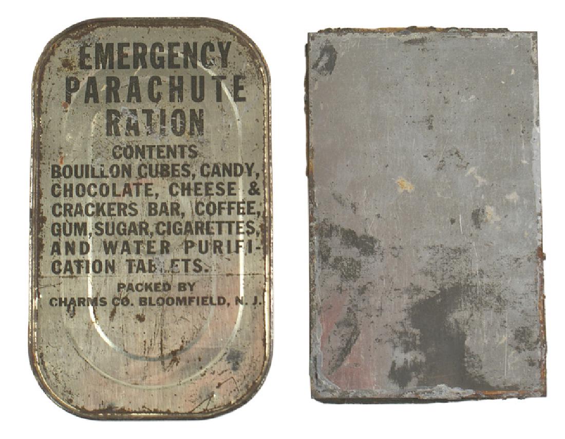 U.S. WWII EMERGENCY PARACHUTE RATION: N-045 U.S. WWII "EMERGENCY PARACHUTE RATION". Contents include "BOUILLON CUBES, CANDY, CHOCOLATE, CHEESE & CRACKERS BAR, COFFEE, GUM, SUGAR, CIGARETTES, AND WATER PURIFICATION TABLETS". Unopened tin w