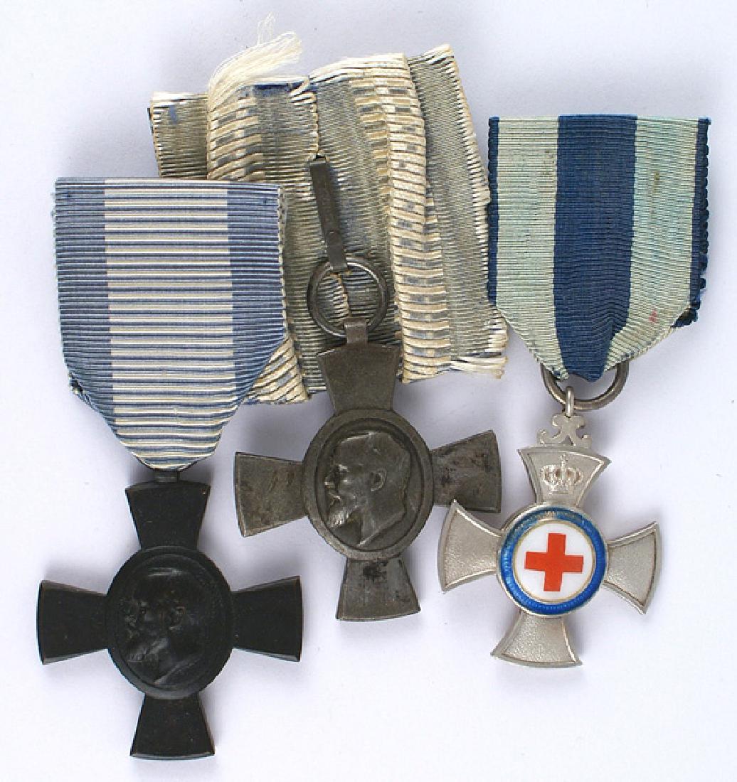 German Bavaria Lot 3 Merit Cross King Ludwig: B-012 Bavaria. Lot of 3: (1) Merit Cross for Volunteer Nursing. Silvered pebbled cross with a relief crown and applied porcelain Red Cross. Reverse roundel has the Bavarian coat-of-arms. (2) King Ludw