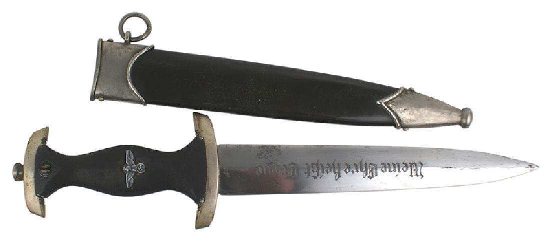 German WWII SS EM dress dagger: D-003 SS EM dress dagger. Age toned nickeled pommel and cross guard (marked "Nrh - Neider Rhein). Enameled SS runes and eagle/swastika in grip (appears to be replaced). 9 3/8" double edged blade with 