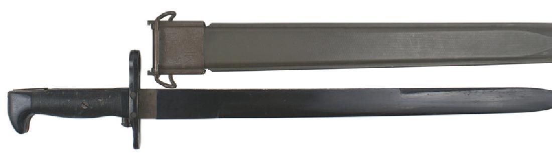 USN Garand M1942 training bayonet: D-041 USN Garand M1942 training bayonet. Black Bakelite grip, pommel and cross guard/muzzle ring. 16" black Bakelite blade. Marked "B.M. CO. VP NORD - 3066" and "U.S.N. MARK 1". Green fiber scabbard w