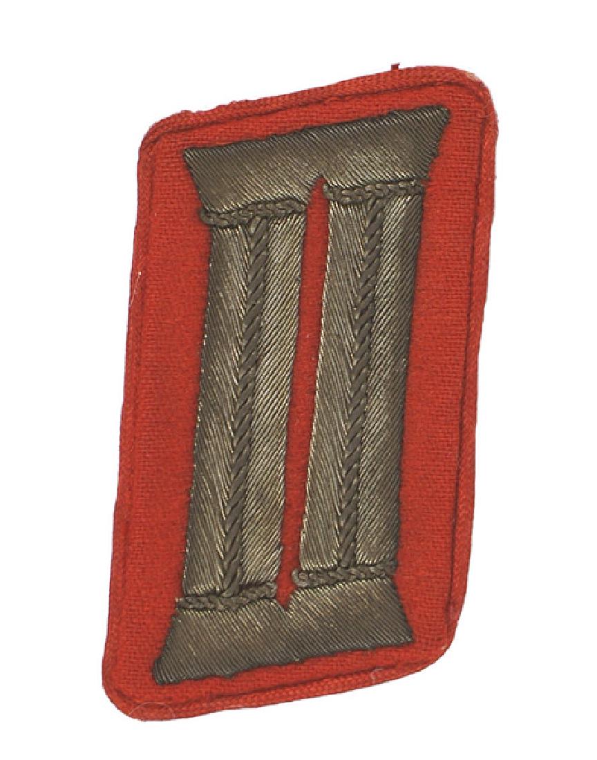 German WWII NSDAP Administrative collar tab: H-031 N.S.D.A.P. Administrative Gauinspector single collar tab. 1933-1935 pattern. Age toned silver bullion "bars" on a rectangular red field with red piping. Most of the "RZM" label remains on the re