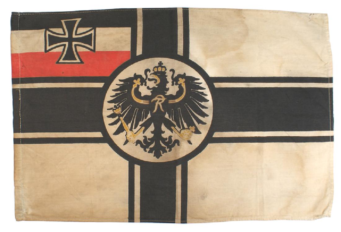 Imperial German Navy flag: H-095 Imperial German Navy flag. White field with a Prussian eagle in center of a black cross with a black Iron Cross on the upper left black/white/red corner. With a cord sleeve 14 1/2" x 21". Age da