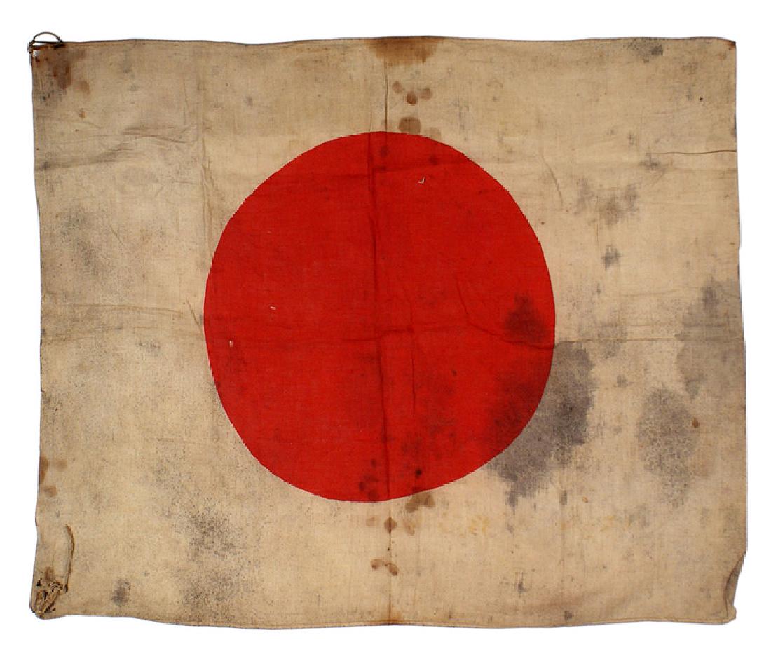 Japanese WWII meatball flag: H-159 Japanese WWII "meatball" flag. Red dyed center on a 20" x 24" linen background. A battlefield pick-up - soiled and with blood stains. Small sections of the corner string ties remain. II-