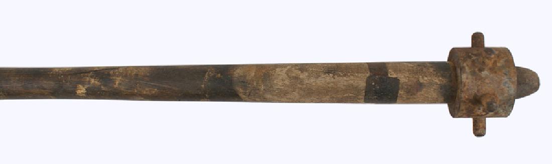 German WWI trench club: N-002 German WWI trench club. 17" round shaft with a heavy 1 5/8" wide iron collar having six round extended posts. Retains some of the original gray finish. Bottom end of the handle is chipped. About