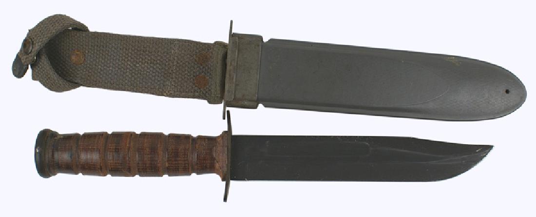 US Navy WWII Mark 2 fighting knife type 2: D-090 US Navy WWII Mark 2 fighting knife-Type 2. Crossguard is marked "USN MARK 2 - Camillus NY. Leather grip and a 7" parkerized blade. Cross guard marked "USN MARK II" and "CAMILLUS N.Y." Gray fiber