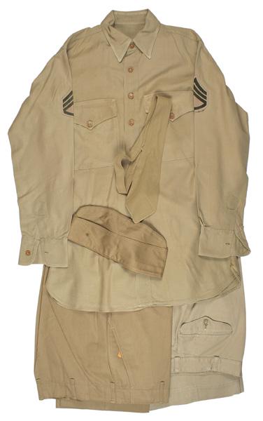 US Army WWII summer uniform: F-030 US Army WWII summer uniform. Consist of: (1) Tan shirt with Staff Sgt. chevrons. (2) Tan trousers. Size 34. (3) Tan trousers - darker shade than above. Size 32. With paper label still attached. 