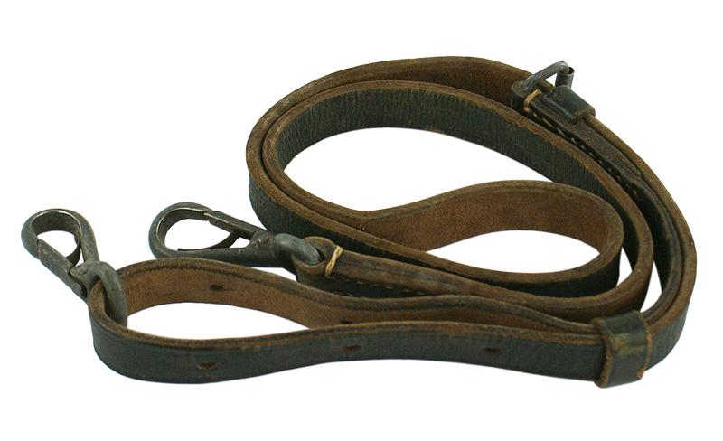 German WWII leather cross shoulder strap: F-057 German WWII leather cross-shoulder strap. Snap hooks on ends. II-
