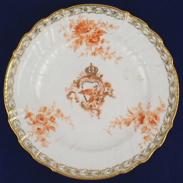 Porcelain dinner plate service of Kaiser Wilhelm II: A-004 Elaborate porcelain dinner plate from the service of Kaiser Wilhelm II. Ripple pattern white porcelain with orange toned floral decorations and a center panel of the Imperial crowned Prussian ea