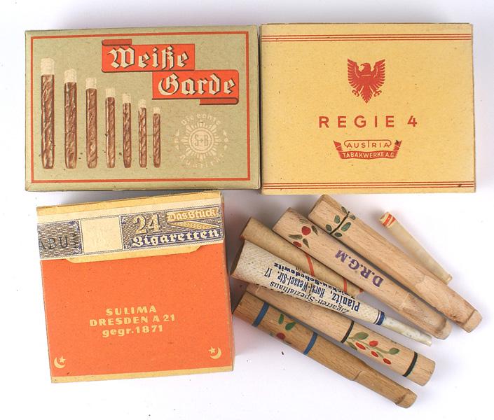 German WWII military issue cigarettes cigars: H-137 Lot of 3 unopened boxes of German WWII military issue cigarettes/cigars. Two different cigarette brands - "SULIMA" and "REGIE 4". Both have unbroken Third Reich tax seals. "Weisse Garde" cigars