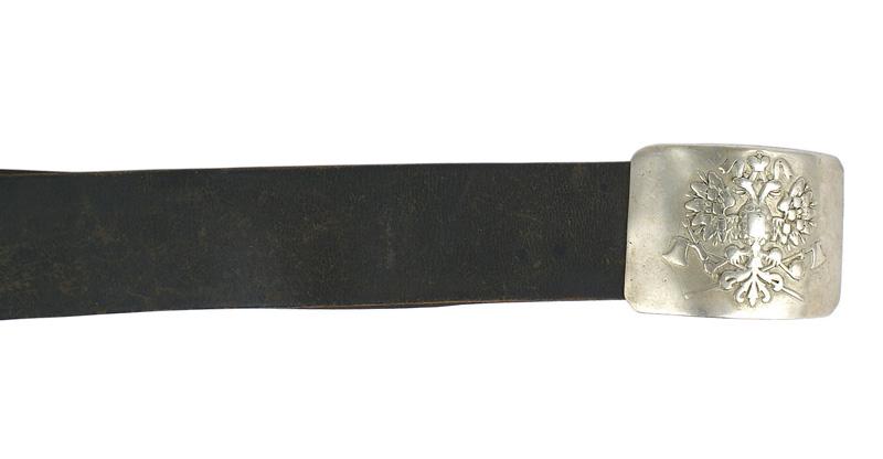 Imperial Russian Pioneer belt and buckle: H-221 Imperial Russian Pioneer belt and buckle. Convex white metal rectangular buckle with a relief double-headed crowned eagle with crossed axes. Black leather belt shows some expected wear. WWI era.