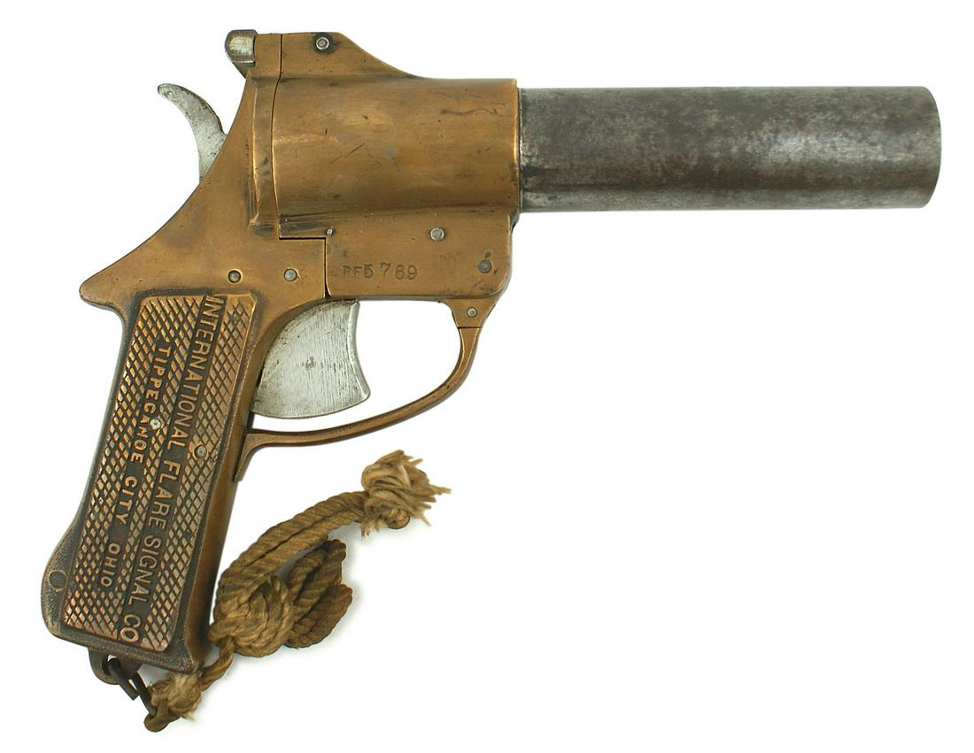 American US WWII flare pistol massive construction: M-029 American WWII flare pistol. Massive construction - steel 1 1/2" diameter, 5 1/4" length barrel and brass receiver/checkered grips. Maker's name in relief "INTERNATIONAL FLARE SIGNAL CO. - TIPPEC