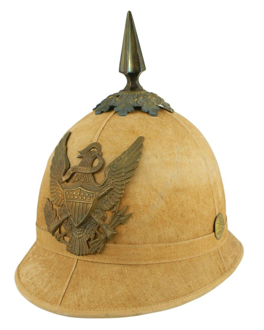 US Infantry summer EM cork helmet M1881: K-108 U.S. Infantry age toned summer EM cork helmet. 1 3/4" split on right side. Brass M1881 U.S. eagle/shield/crossed 45-70 rifles front plate, base/spike/crossed rifles side button. Leather sweatban
