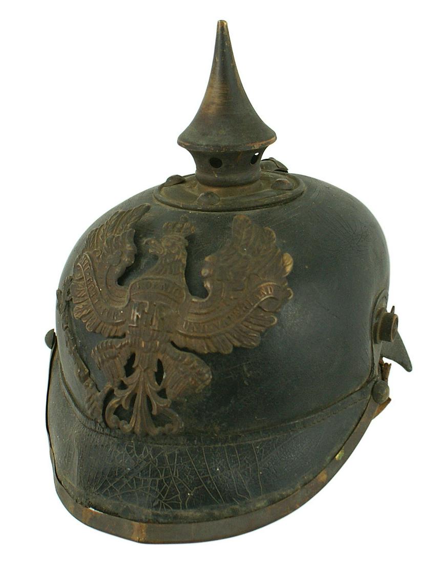 Prussian WWI EM pickelhaube helmet: E-006 Prussian WWI EM "pickelhaube". Similar to above, but with an age darkened brass eagle frontplate (missing left talon/orb), spike/base and trim. Fairly solid body. Crazed front visor (brass trim 