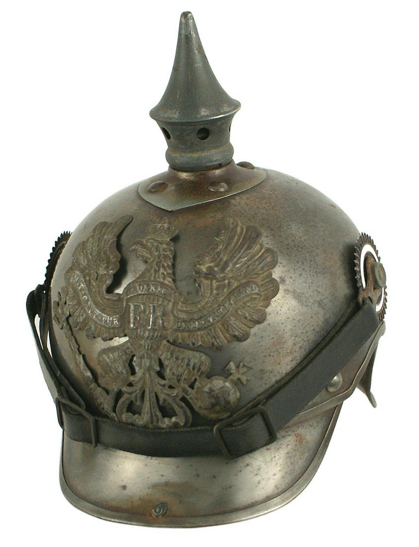 Imperial German Cuirassier EM helmet: E-009 Imperial German Cuirassier EM helmet. Age darkened steel skull with pewter trimmed sloped visor and "lobster - tail". Gray "football" base and spike top. Large Prussian eagle front plate. Small 