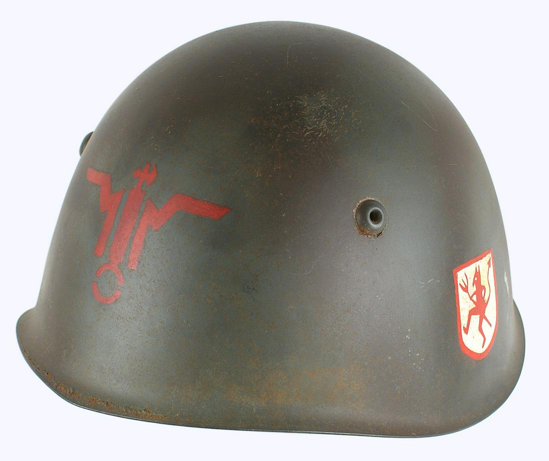 Italian WWII Republican National Guard helmet: E-059 Italian WWII Republican National Guard helmet. Standard field green finish with red painted insignia-winged fasces and painted decal of a devil with a pitch fork (probably a later addition). Lea