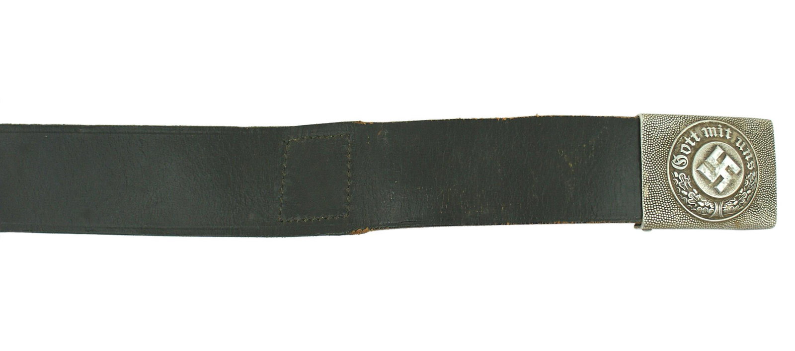 German WWII Police EM belt and buckle: F-024 German WWII Police EM belt and buckle. Pebbled aluminum buckle with a relief swastika, "GOTT MIT UNS" and oak leaves. Reverse marked "C.T.D.". Solid black leather belt. Size 46. II