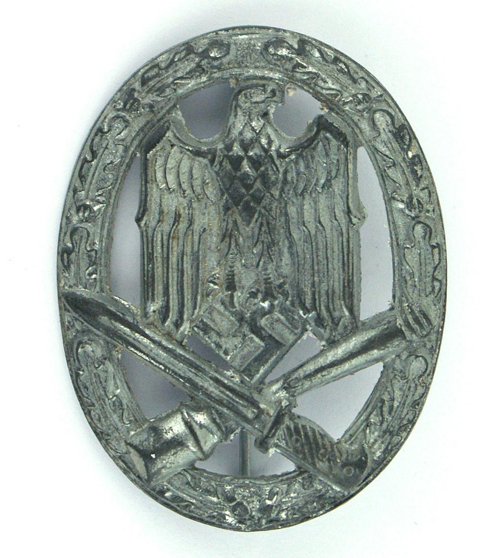 German WWII Army W-SS General Assault Badge: B-057 German WWII Army/W-SS General Assault Badge - Silver. Eagle/swastika and crossed bayonet/stick grenade on an open oak leaf wreath. Solid wartime type. II