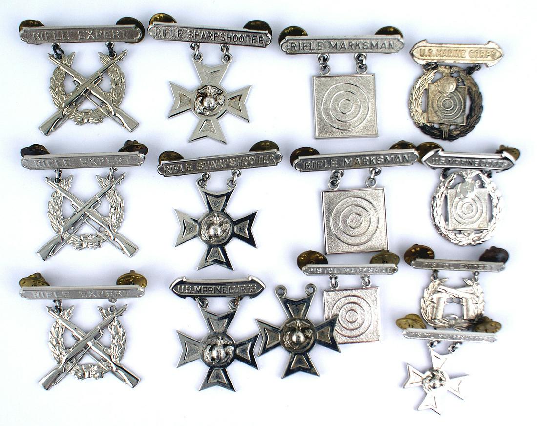 Lot of USMC STERLING marksmanship badges: B-085 Lot of US Marine Corps "STERLING" clutch - back marksmanship badges: (1) Target - with "PISTOL MRKSMAN" bar. (2) Cross/EGA with "PISTOL SHARPSHOOTER" bar. (3) Crossed pistols with "PISTOL EXPERT
