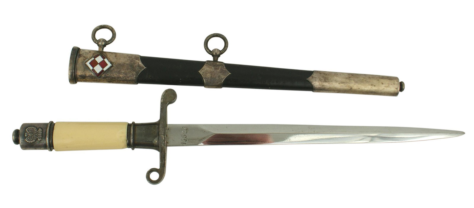 Polish post war Air Force officer dagger: D-042 Polish post war, Communist Period Air Force Officer's dagger. Age toned white grip. Silvered eagle decorated pommel, crossguard and scabbard fittings have all aged to a purple patina. Red and wh