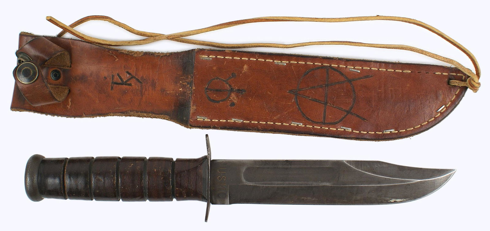 USMC fighting knife: D-052 US WWII Marine Corps fighting knife. 6 7/8" Bowie type 1 1/2" wide blade. 90% original dark finish. Marked "USMC" and "KA-BAR OLEAN N.Y.". Leather scabbard with staples and stitching. Retaining 